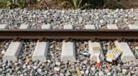 Painting The Sides Of Railroad Rails White To Reduce Derailment